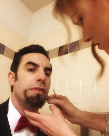 Isla Fisher putting beard on Sacha Baron Cohen in toilet for 2016 Oscar prank